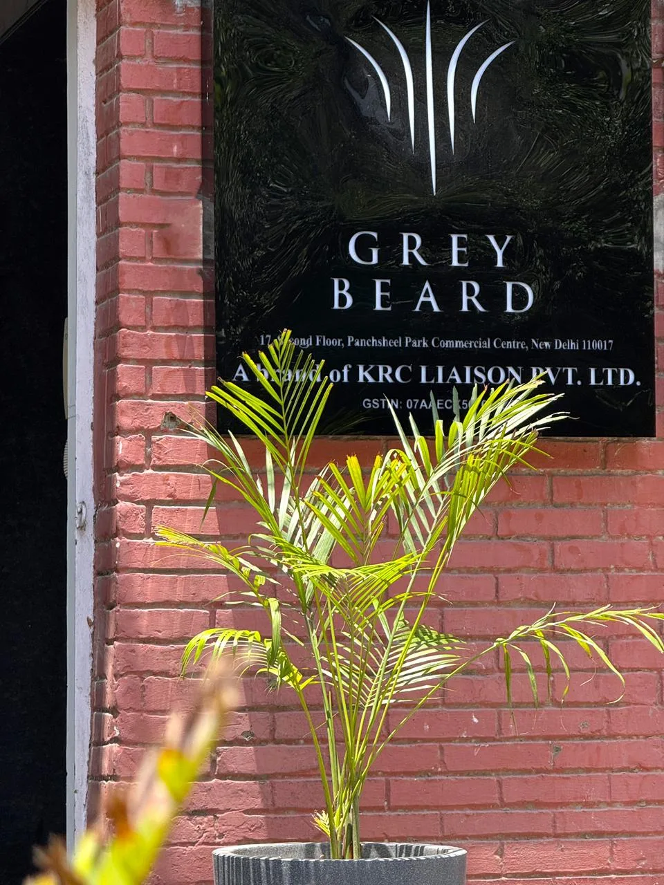 The Grey Beard sign at the office in Panchsheel Park: a brand of KRC Liaison Pvt Ltd