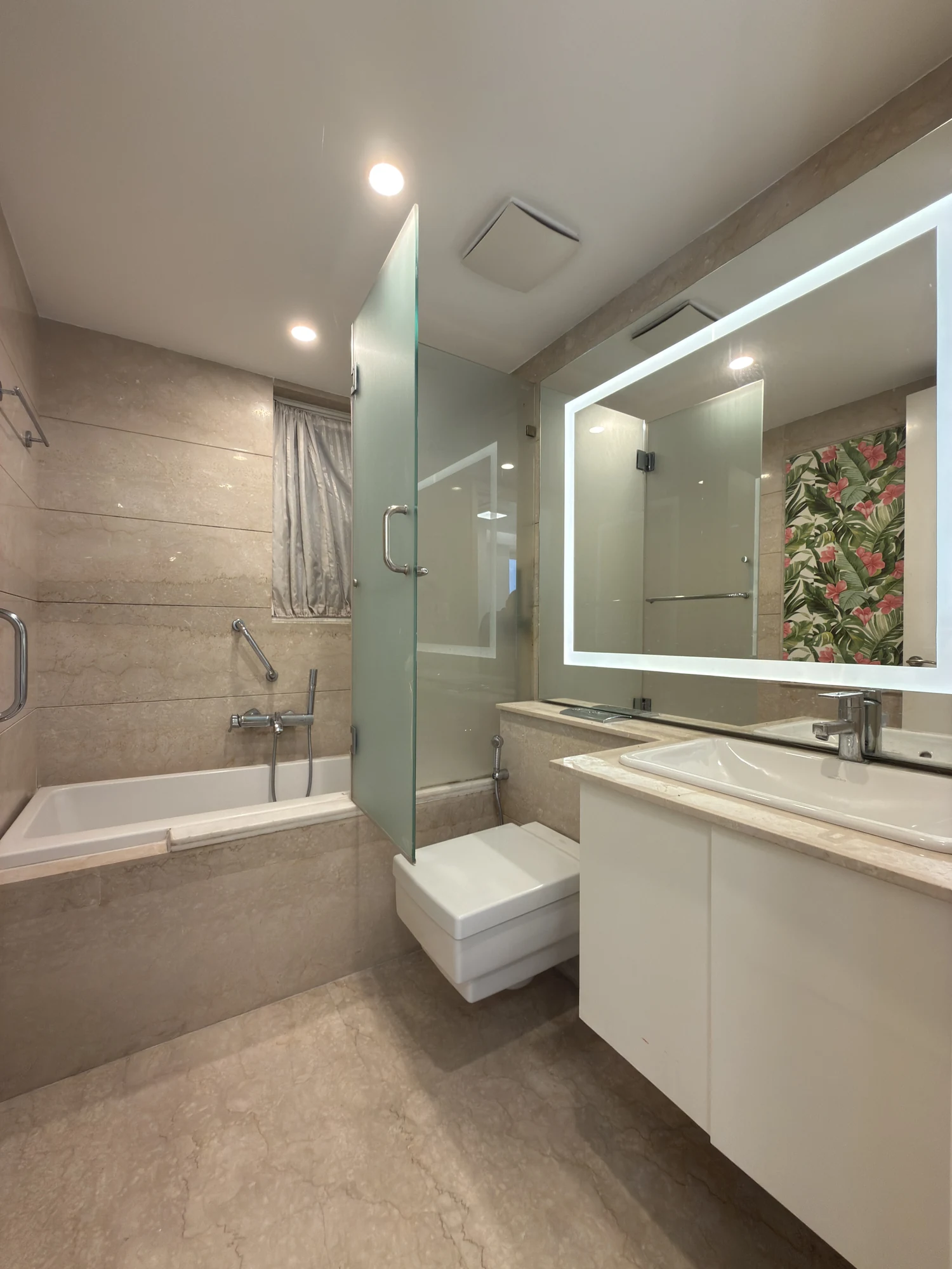 Bathroom with a bathtub and glass shower