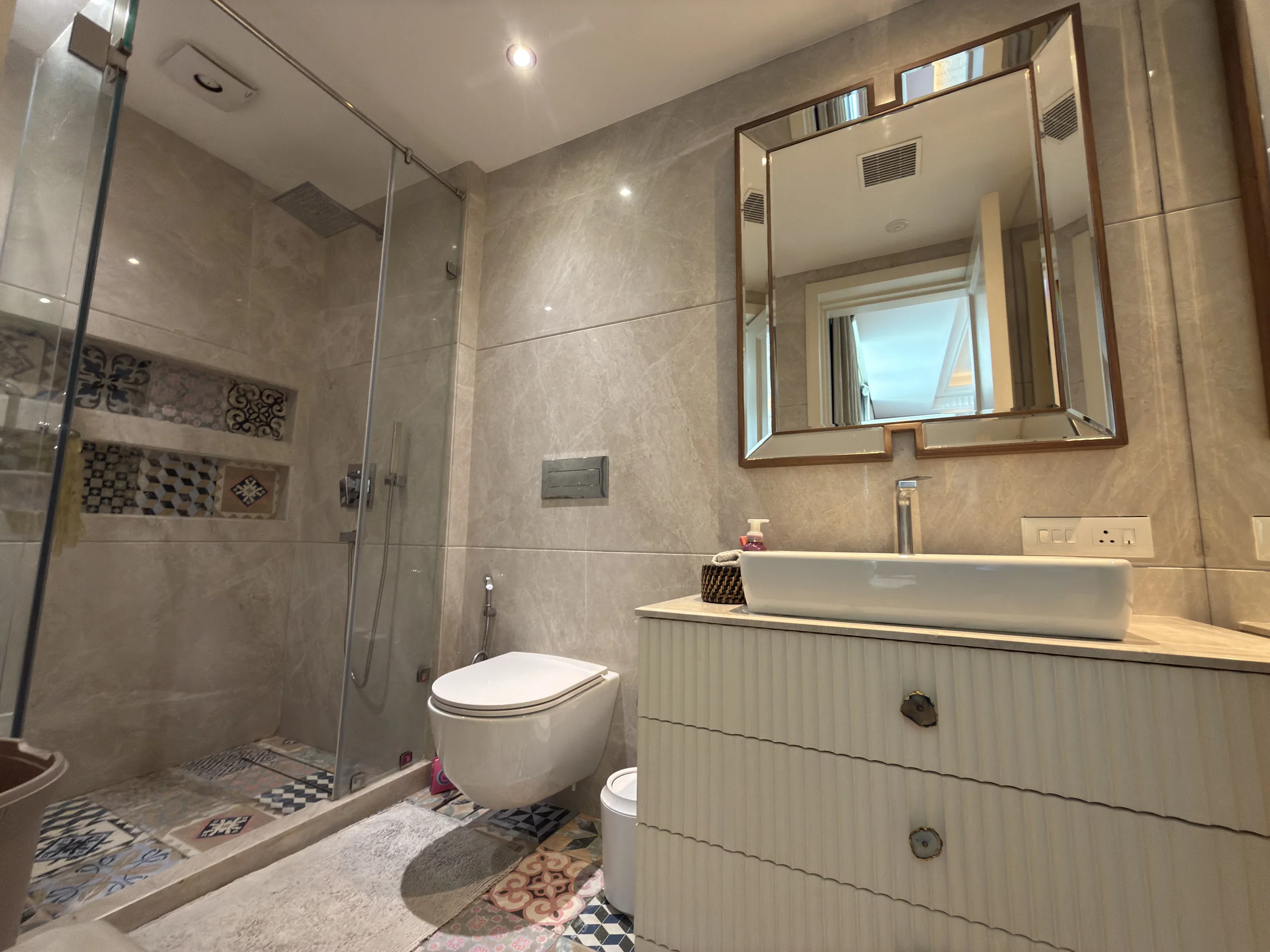 A bathroom with a glass shower